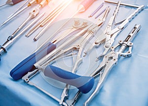 Sterilized surgical instruments and tools on the blue table. A spine surgery