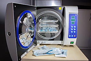 Sterilizing medical instruments in autoclave.