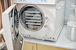 Sterilizing medical instruments in autoclave in medical clinic