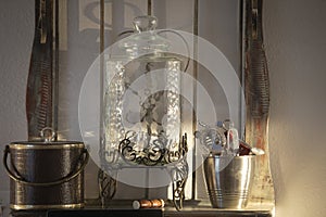 Sterling Silver ice bucket. water dispenser, and knick knack bucket on antique vanity.