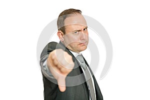 Stern, angry business man giving thumbs down