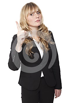 Stern businesswoman delivering a reprimand