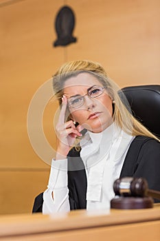 Stern judge looking at camera