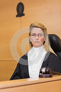 Stern judge looking at camera