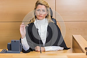 Stern judge looking at camera