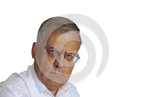 The stern look of an aged man. On a white background, close up