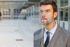 Stern man blowing the whistle in office space photo