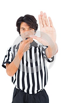 Stern referee showing stop sign with hand
