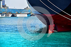 Stern ship mooring alongside in the sea with rudder