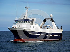 Stern Trawler Underway at Sea. photo