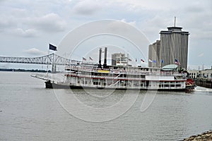Sternwheeler leaving the dock on the Mississippi river photo