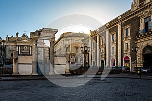 Stesicoro Square and the entrance to the Ruins of the Roman Amphitheater at sunset - Catania, Sicily, Italy photo