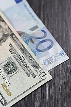 Steth on top of pile of hundred banknotes