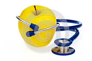 Stethoscope and apple. healthy eating