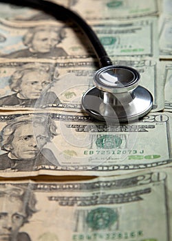 Stethoscope on a background of $20 bills