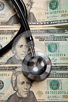 Stethoscope on a background of $20 bills