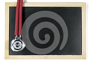 Stethoscope and blackboard