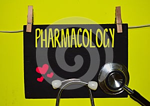 PHARMACOLOGY on top of yellow background. photo