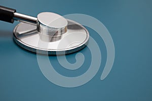 Stethoscope on blue background