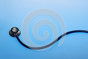 Stethoscope on blue background