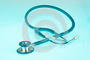 Stethoscope on blue background