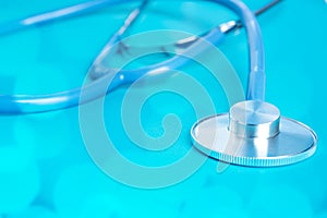 Stethoscope blue background, healthcare treatment and medicine concept