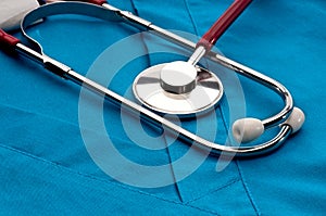 A stethoscope on blue doctor's scrubs