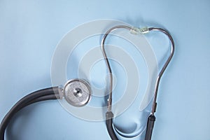 Stethoscope on blue table background