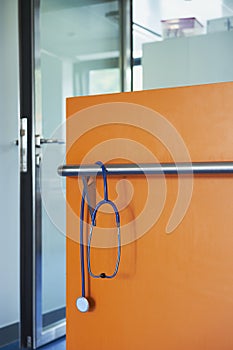 Stethoscope blue wall glass orange door