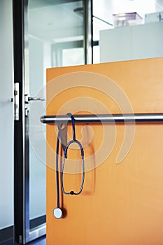 Stethoscope blue wall orange door glass