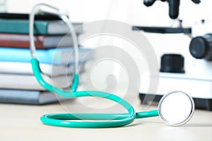 Stethoscope and books on table.