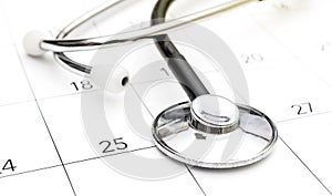 Stethoscope on calendar. Medical appointment concept