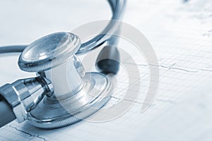 Stethoscope and cardiogram on the form