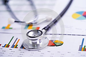 Stethoscope, Charts and Graphs spreadsheet paper, Finance, Account, Statistics, Investment, Analytic research data economy.