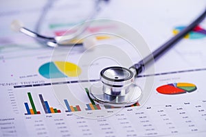 Stethoscope, Charts and Graphs spreadsheet paper, Finance, Account, Statistics, Investment, Analytic research data economy