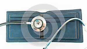 Stethoscope check money on empty wallet bag