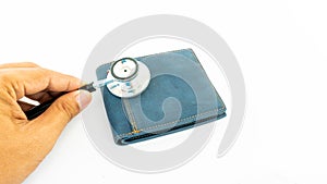 Stethoscope check money on empty wallet bag