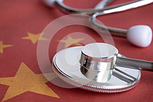 Stethoscope on China national flag.Corona Virus outbreak concept. China Crisis