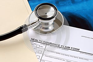 A stethoscope on the claim form