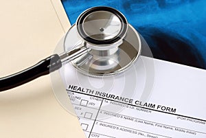 A stethoscope on the claim form