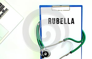 Stethoscope and clipboard with RUBELLA text on white sheet of paper