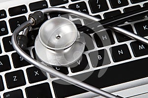 Stethoscope on a computer keyboard