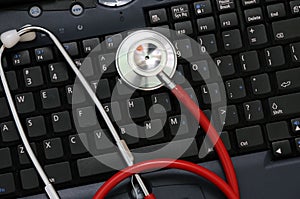 Stethoscope on a computer keyboard