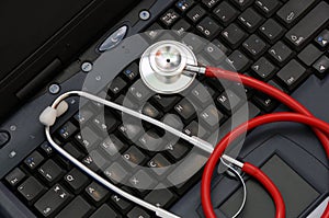 Stethoscope on a computer keyboard