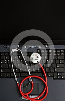 Stethoscope on a computer keyboard