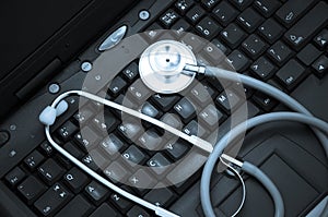 Stethoscope on a computer keyboard