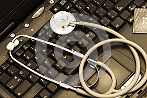 Stethoscope on a computer keyboard