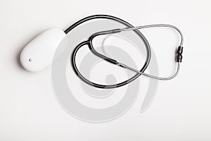 Stethoscope with computer mouse on white