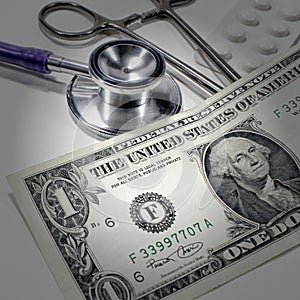 Stethoscope dollar , expenditure on health or financial assistance photo