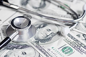 Stethoscope on the dollars. Medical costs. Healthcare payment concept. Concept of analysis of the market and economy and interest